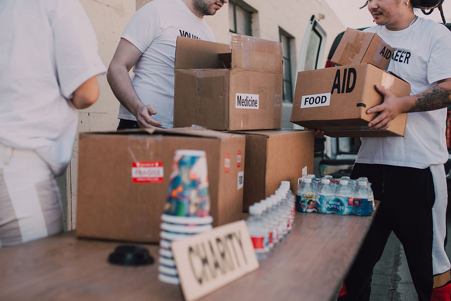 Volunteers organizing community aid supplies