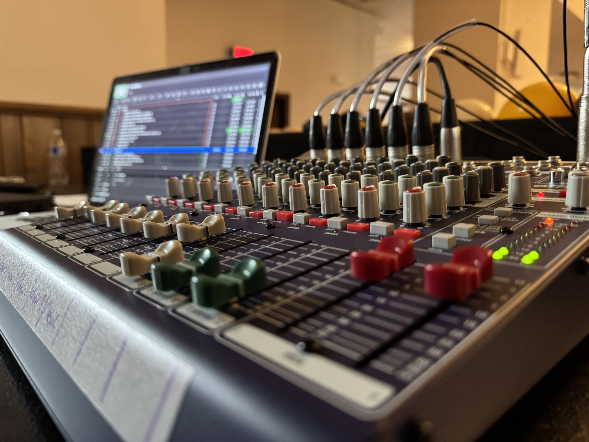Audio mixer and production laptop at a live Veranda event