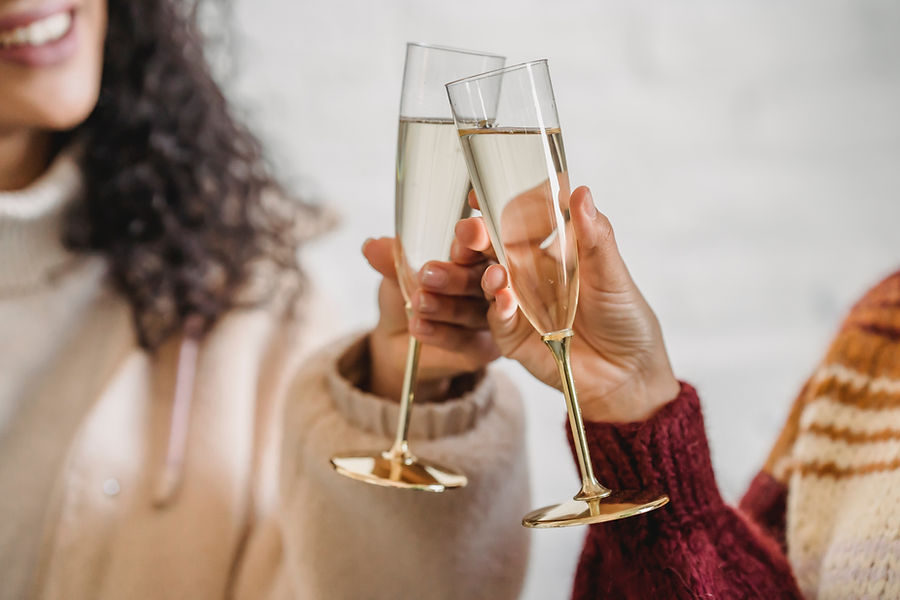 Guests raising champagne glasses at a celebration